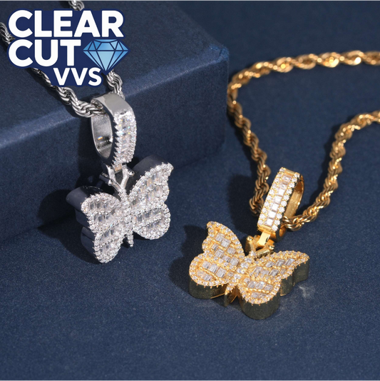 Butterfly-shaped pendants on chains with 'Clear Cut VVS' branding on a dark blue background.