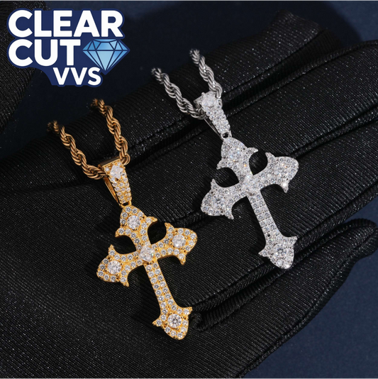Two diamond-encrusted cross pendants on black gloves with 'Clear Cut VVS' logo.