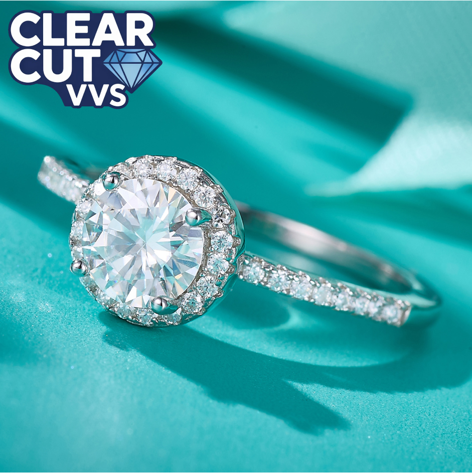 Diamond ring with 'Clear Cut VVS' label on a teal background
