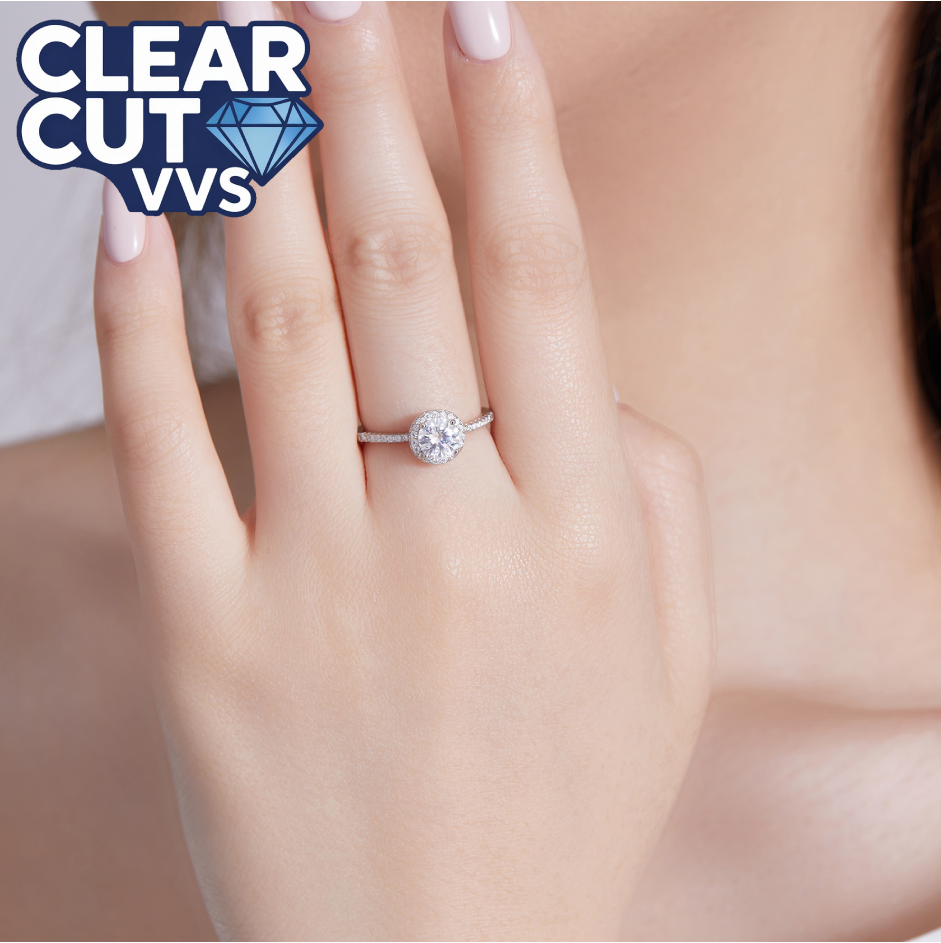 Diamond ring on a hand with 'Clear Cut VVS' logo