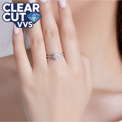 Diamond ring on a hand with 'Clear Cut VVS' logo